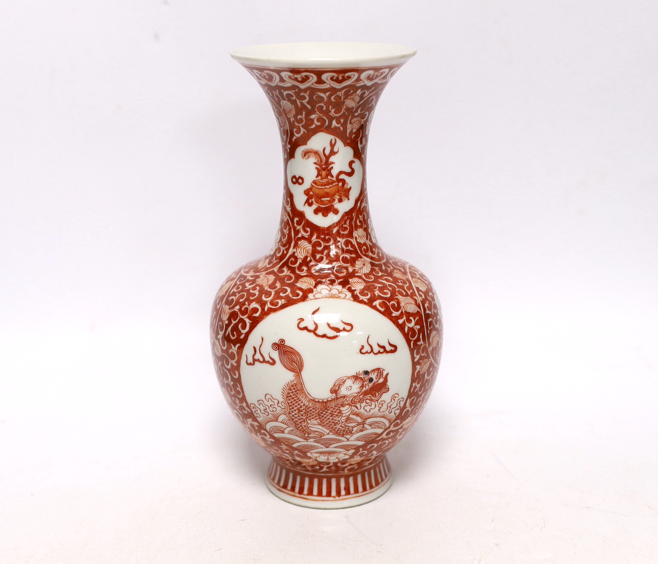 A Chinese iron red enamelled 'mythical beast' vase, early 20th century, 21cm high